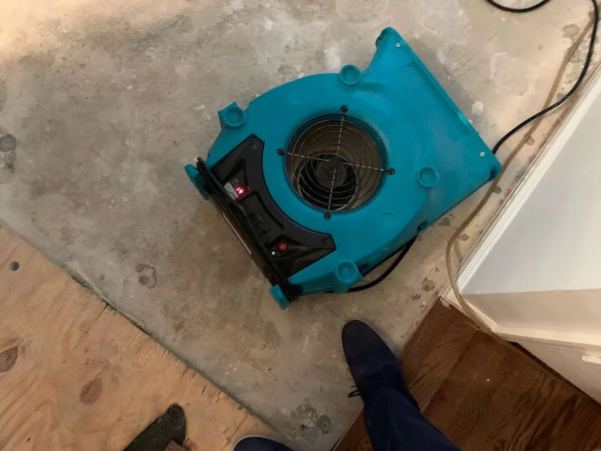 Air mover drying subfloor during Leak Detection & Repair in Grosse Pointe Woods