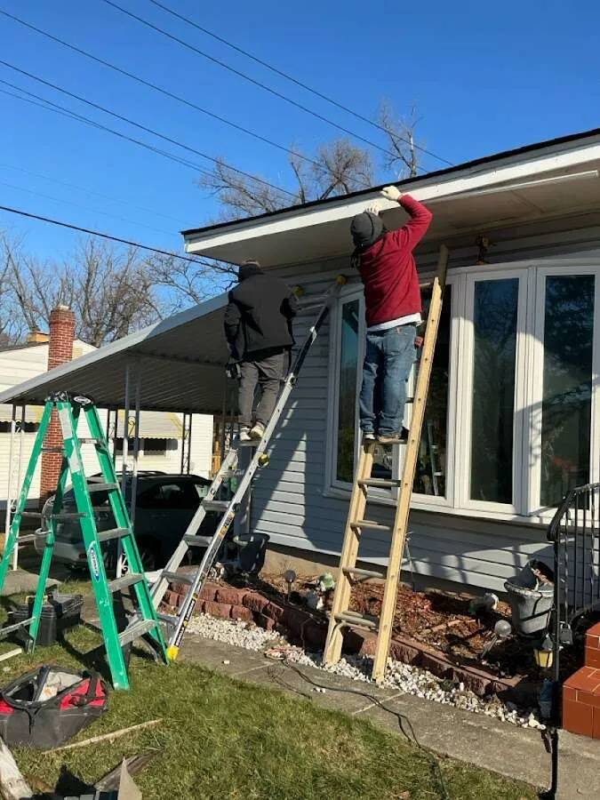 Restoration crew performing exterior repair in Grosse Pointe Woods